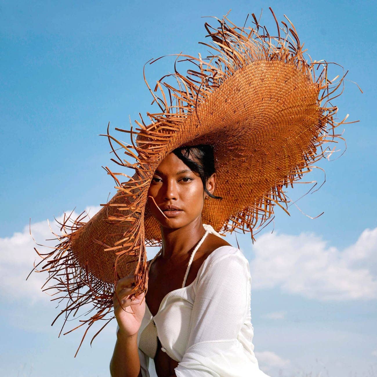 AMORA Oversized Frayed Straw Hat In Burnt Caramel Sun Hats
