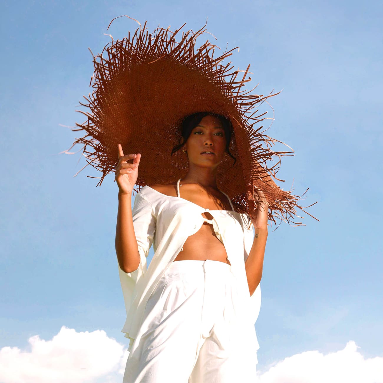 AMORA Oversized Frayed Straw Hat In Burnt Caramel Sun Hats